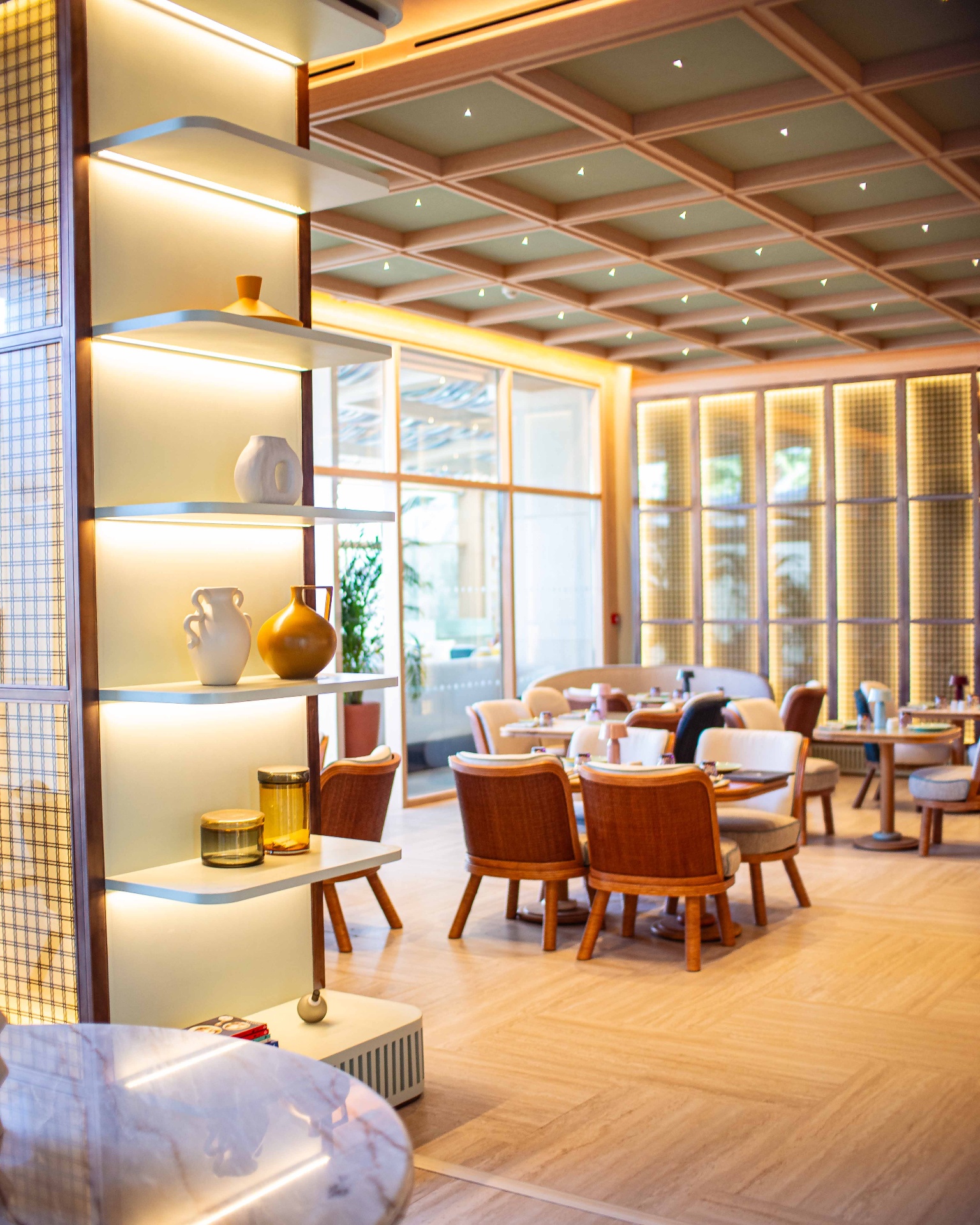 Le V Restaurant interior — vaulted ceilings, warm wood, zellige craftsmanship
